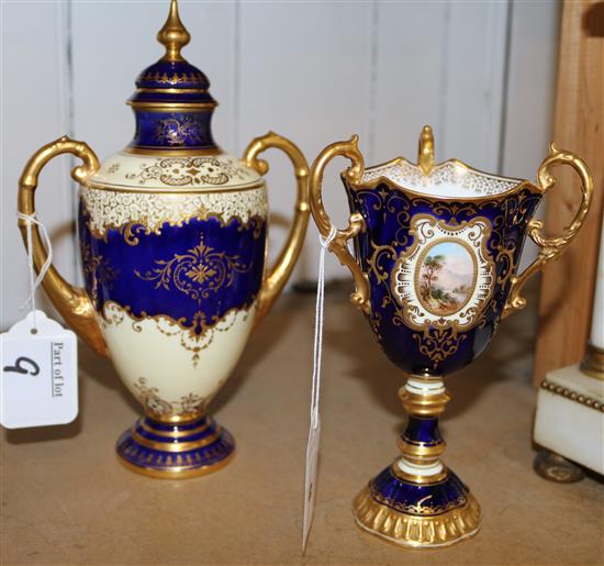 A Coalport landscape painted twin handled vase and cover, and a similar three handled cup, c.1900, 22.5cm and 17.5cm